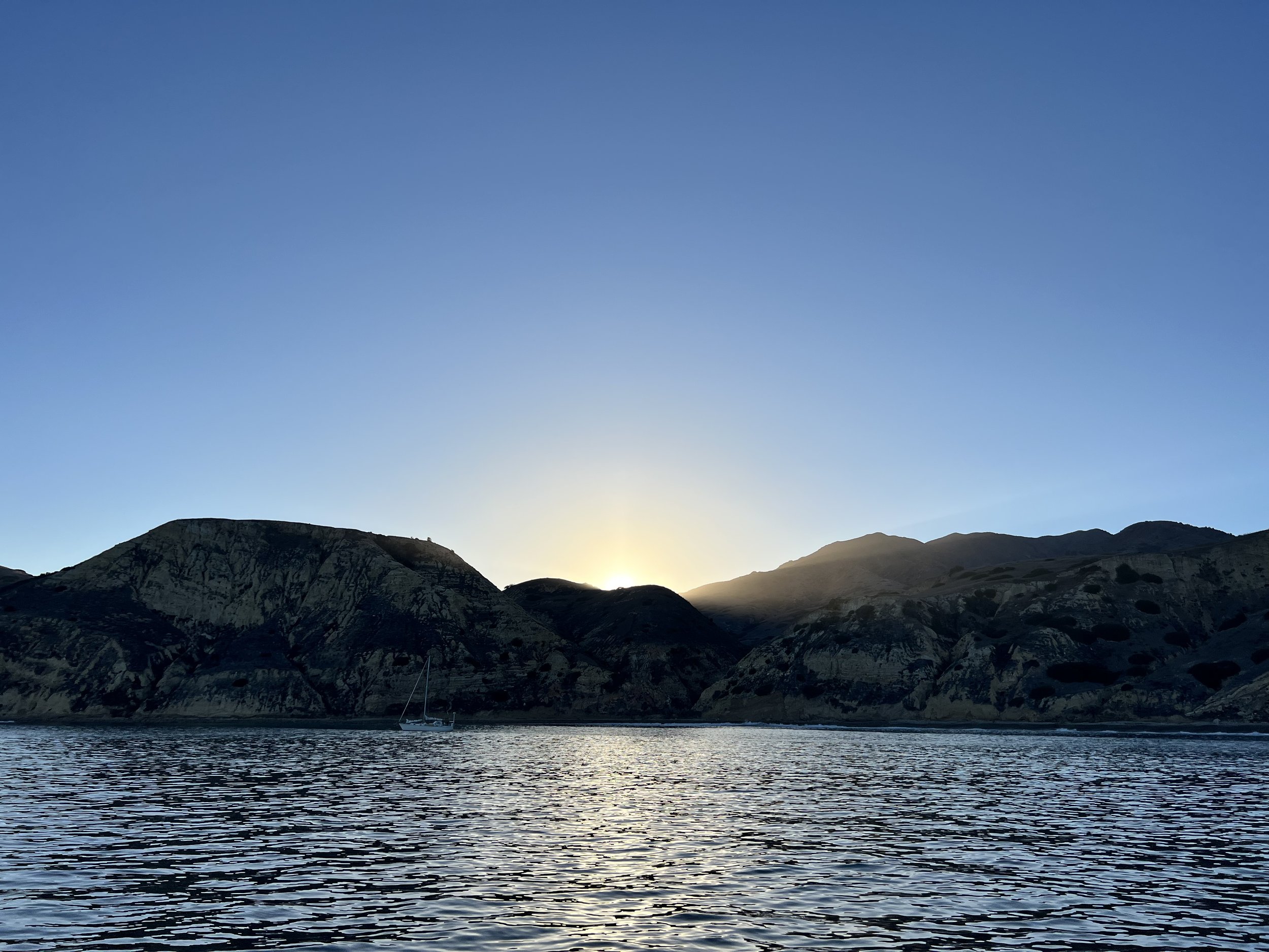 Sun setting behind Santa Cruz Island from Yellowbanks anchorage