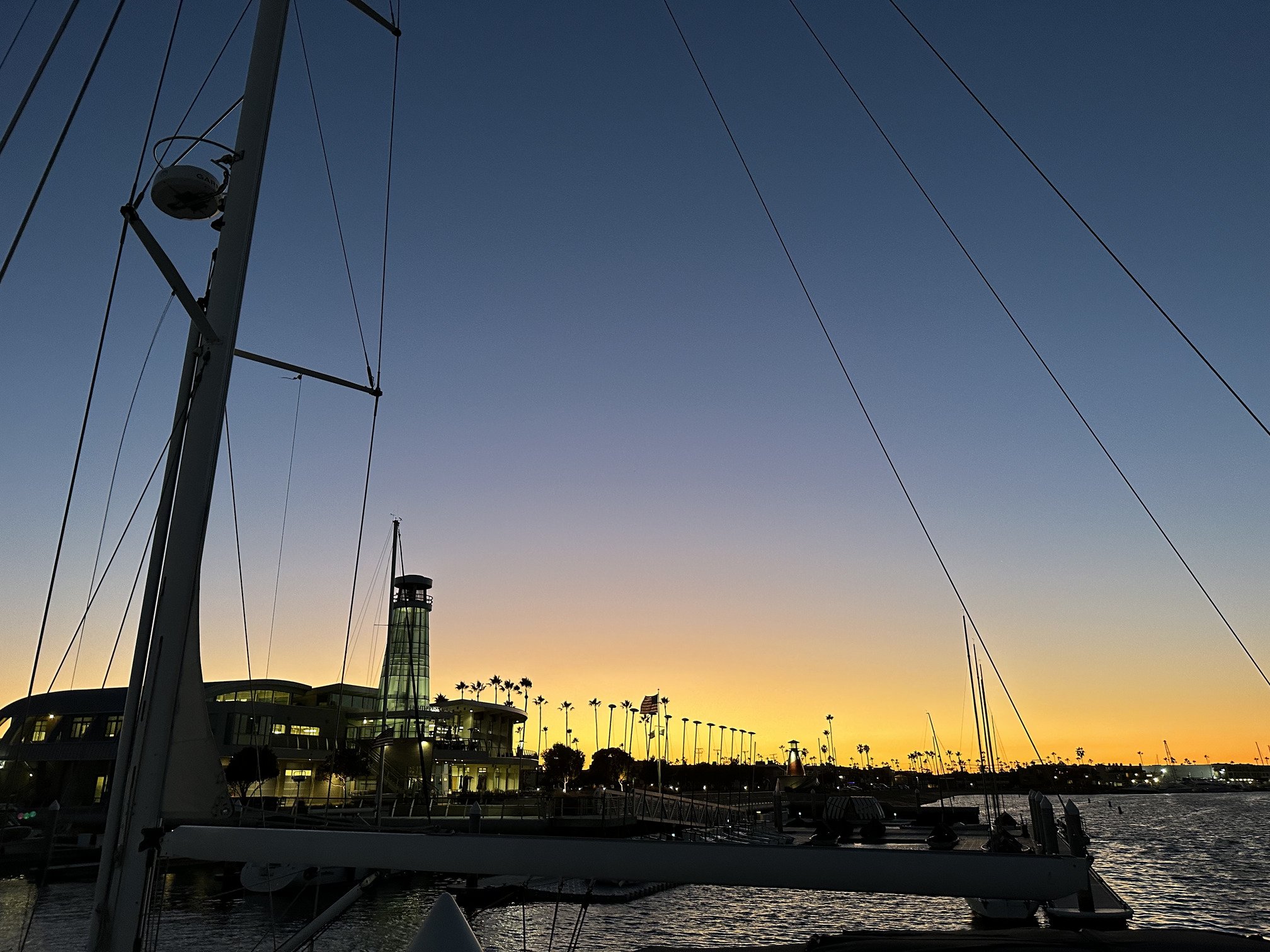 Sunset behind the public marina and Lighthouse Cafe in Newport Beach, CA